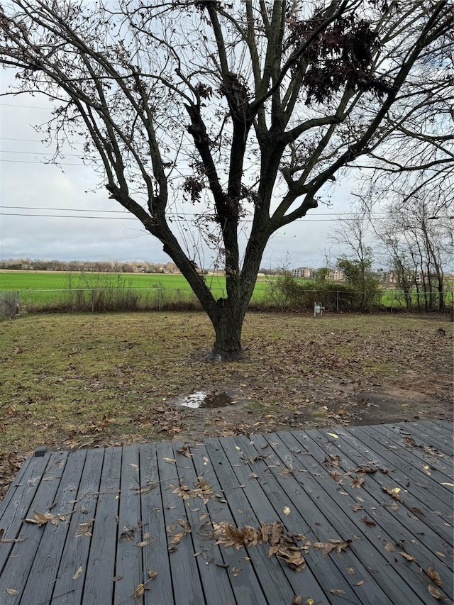 wooden terrace with a rural view