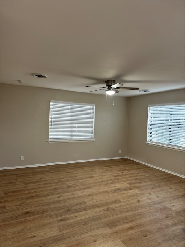 unfurnished room featuring ceiling fan and light hardwood / wood-style floors