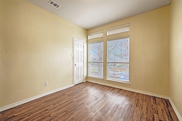 unfurnished room featuring hardwood / wood-style floors