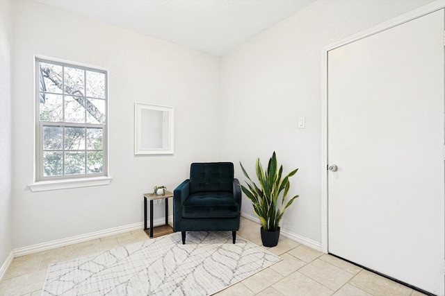 living area featuring light tile patterned flooring