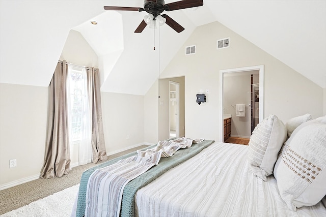 carpeted bedroom featuring connected bathroom, ceiling fan, and vaulted ceiling