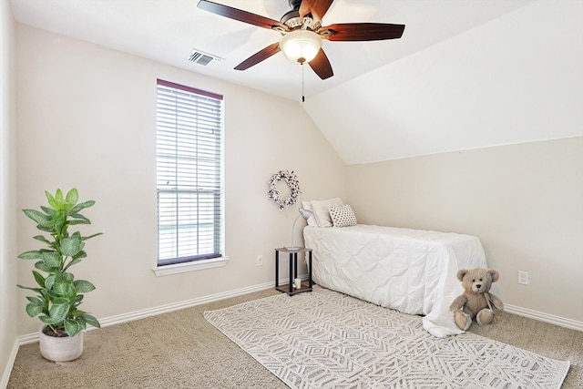 bedroom featuring ceiling fan, light colored carpet, and vaulted ceiling