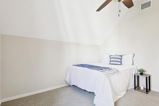 carpeted bedroom with ceiling fan and lofted ceiling