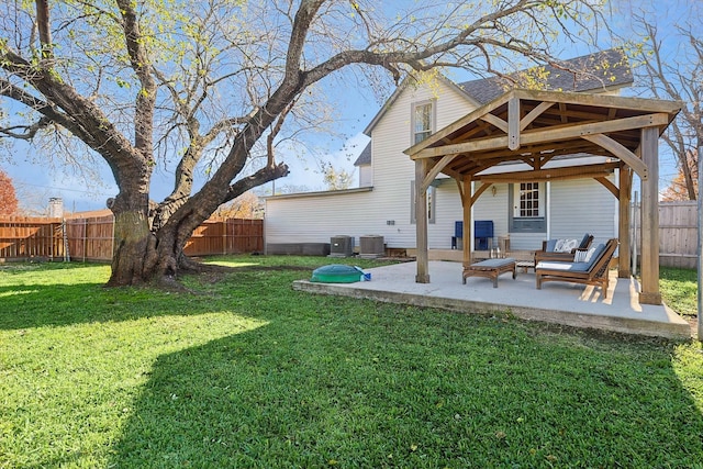 view of yard with cooling unit and a patio area