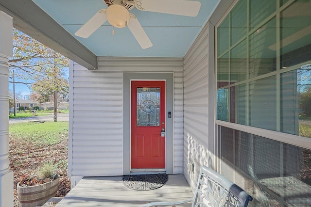 view of exterior entry with ceiling fan