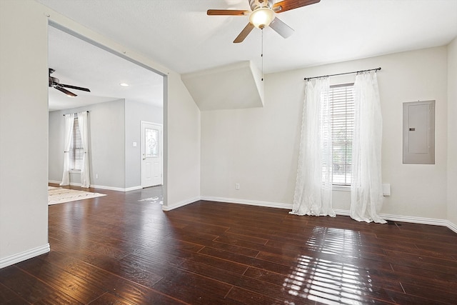 unfurnished room featuring dark hardwood / wood-style flooring, electric panel, and ceiling fan