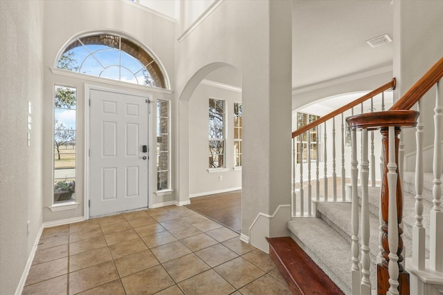 entryway with light tile patterned flooring