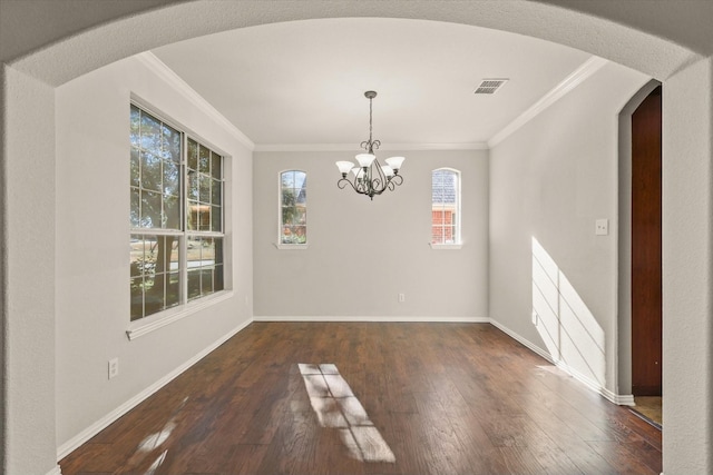 unfurnished dining area with a healthy amount of sunlight, dark hardwood / wood-style flooring, a chandelier, and ornamental molding