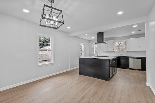 kitchen featuring dishwasher, a center island, hanging light fixtures, island range hood, and white cabinetry