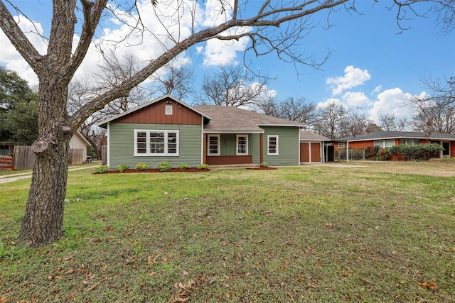 single story home featuring a garage and a front yard