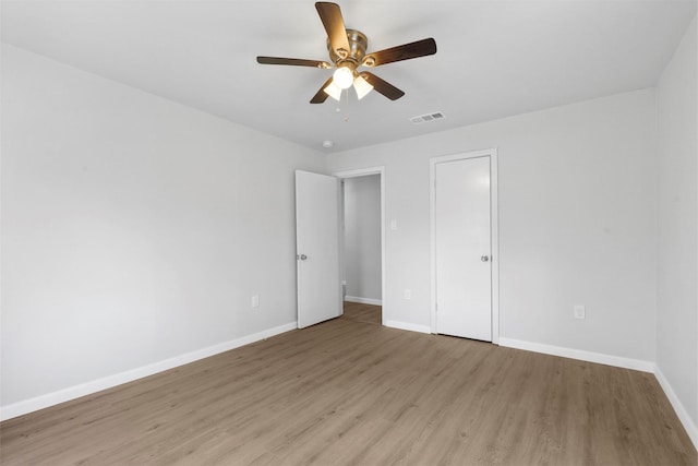 unfurnished bedroom with light hardwood / wood-style flooring and ceiling fan