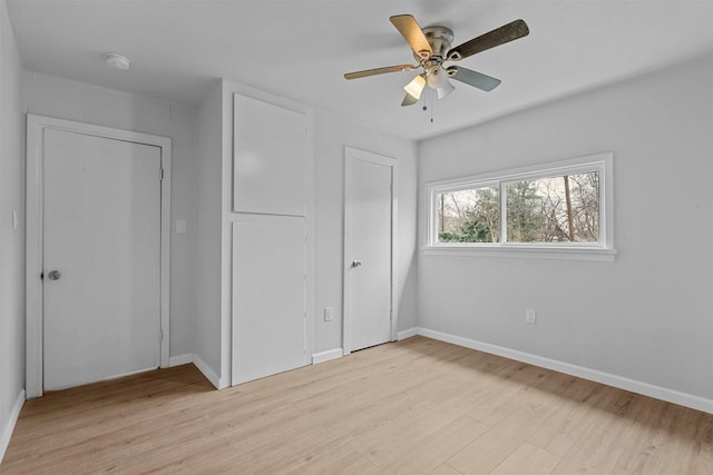 unfurnished bedroom featuring light hardwood / wood-style flooring and ceiling fan