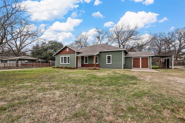 view of front of property with a carport and a front yard