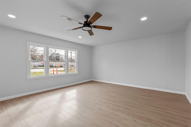 unfurnished room featuring ceiling fan and light wood-type flooring