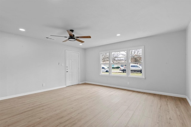 spare room featuring ceiling fan and light hardwood / wood-style floors