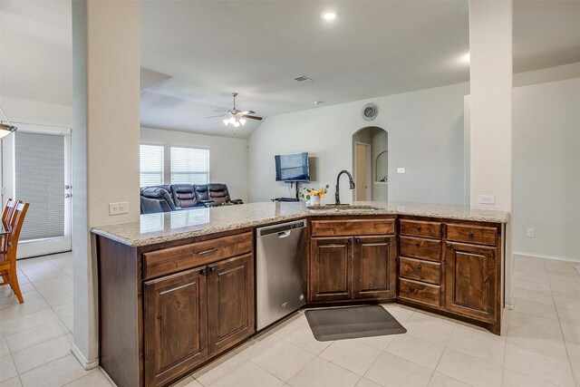 kitchen featuring ceiling fan, sink, stainless steel dishwasher, kitchen peninsula, and vaulted ceiling