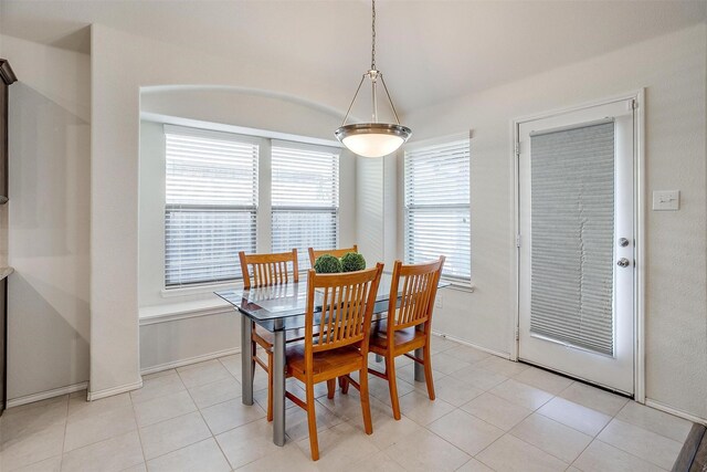 dining area featuring light tile patterned floors