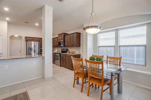 dining room featuring light tile patterned flooring