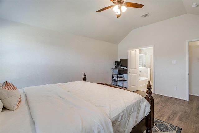 bedroom featuring ceiling fan, wood-type flooring, lofted ceiling, and ensuite bath