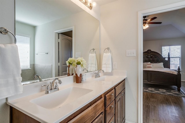 bathroom with hardwood / wood-style flooring, vanity, and ceiling fan