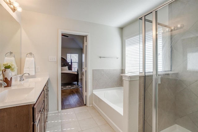 bathroom featuring tile patterned floors, vanity, and independent shower and bath