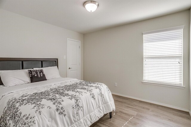 bedroom with light hardwood / wood-style flooring