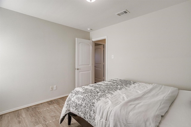 bedroom with light hardwood / wood-style floors