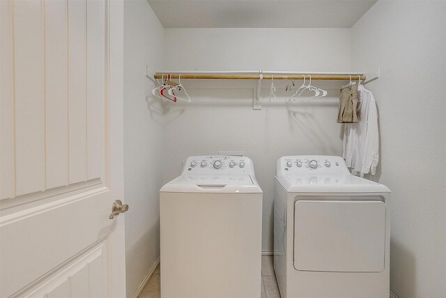 laundry room with separate washer and dryer