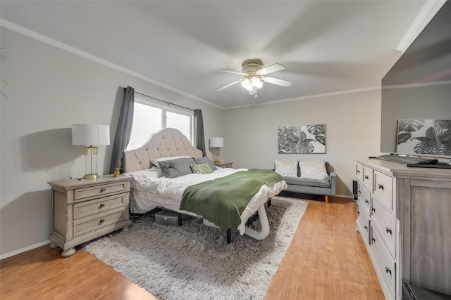 bedroom with light hardwood / wood-style flooring, ornamental molding, and ceiling fan