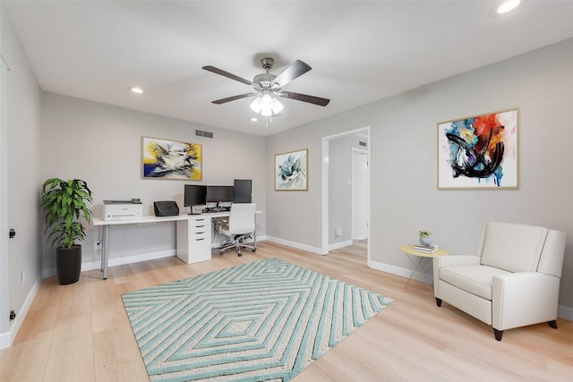 office space with ceiling fan and light hardwood / wood-style flooring