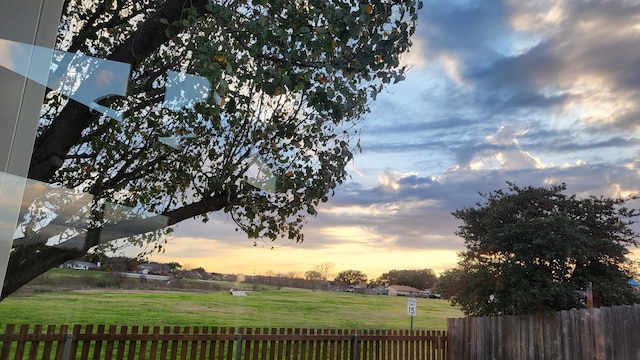 view of yard at dusk