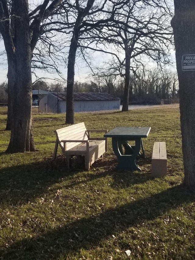 view of home's community with a yard