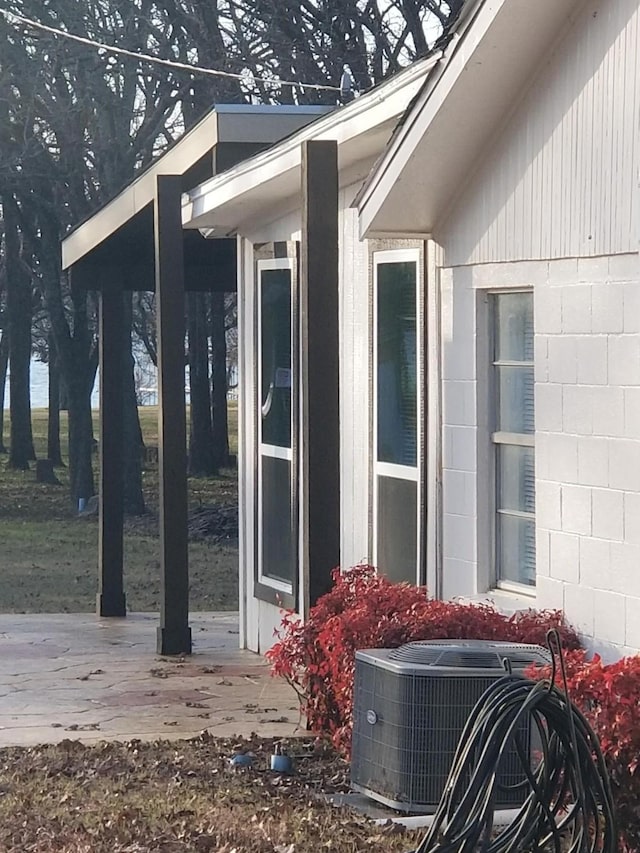 view of home's exterior with central air condition unit