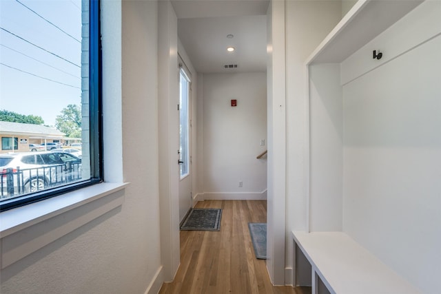 mudroom with light hardwood / wood-style floors