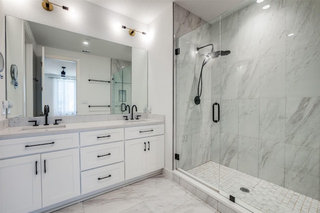 bathroom featuring vanity, ceiling fan, and a shower with shower door