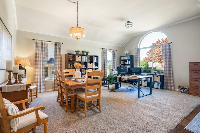 dining area featuring wood-type flooring, vaulted ceiling, and crown molding