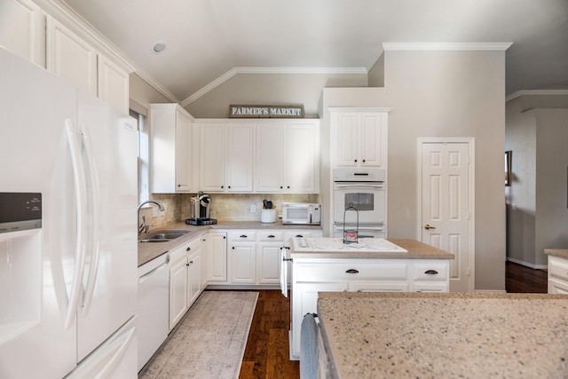 kitchen featuring white cabinetry, sink, dark wood-type flooring, tasteful backsplash, and white appliances