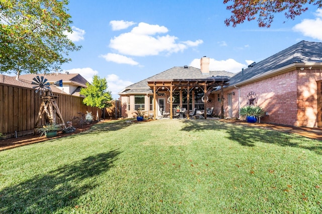 rear view of house featuring a lawn