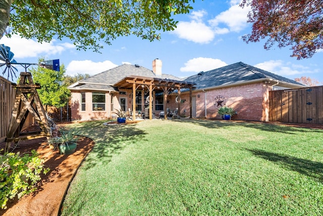 back of property featuring a lawn and a pergola