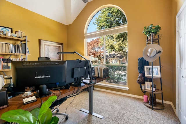 office featuring plenty of natural light, lofted ceiling, and carpet floors