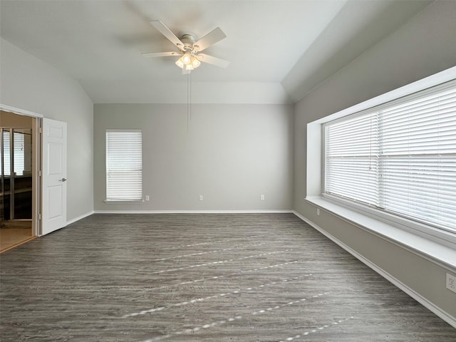 unfurnished room featuring dark wood-type flooring, ceiling fan, and lofted ceiling