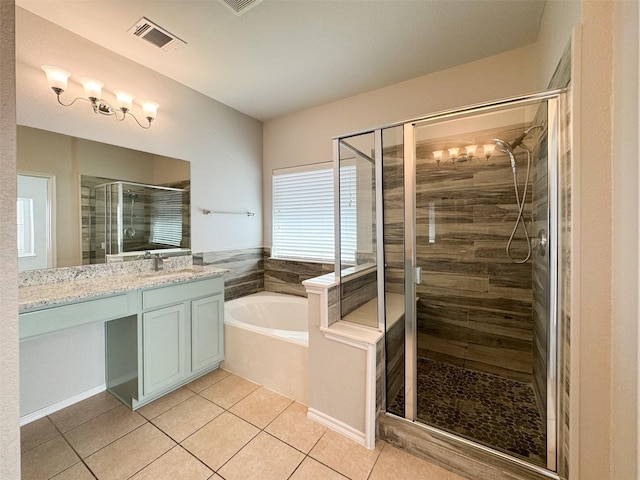 bathroom featuring tile patterned flooring, vanity, and separate shower and tub