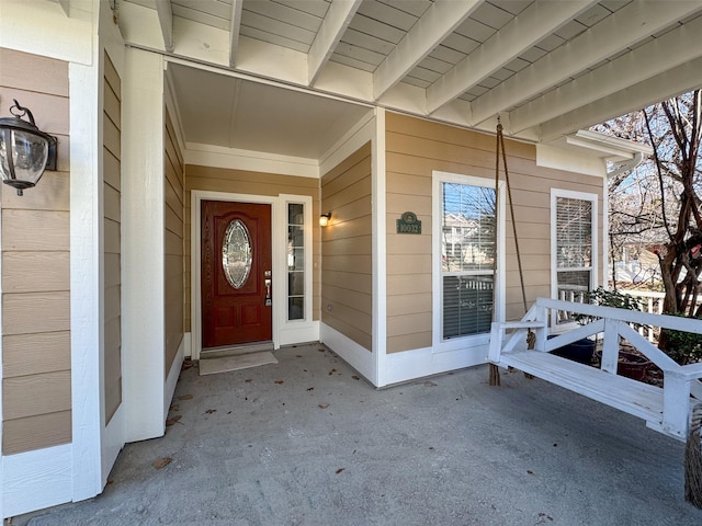 doorway to property featuring a porch