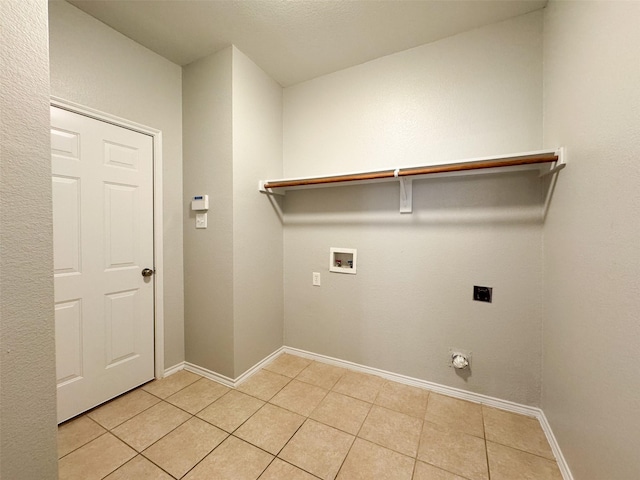 laundry area featuring light tile patterned flooring, hookup for an electric dryer, and washer hookup