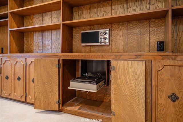 room details featuring carpet and a wall unit AC