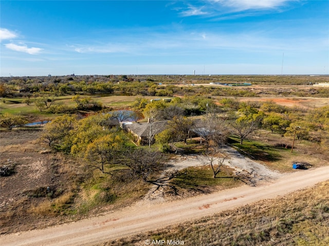 birds eye view of property with a rural view