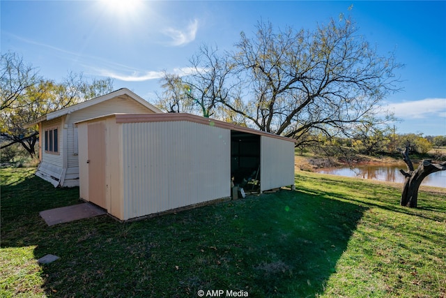 view of outbuilding featuring an outbuilding and a water view