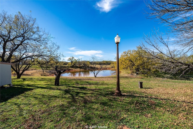 view of yard with a water view