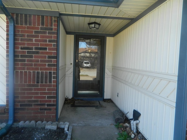 property entrance with brick siding