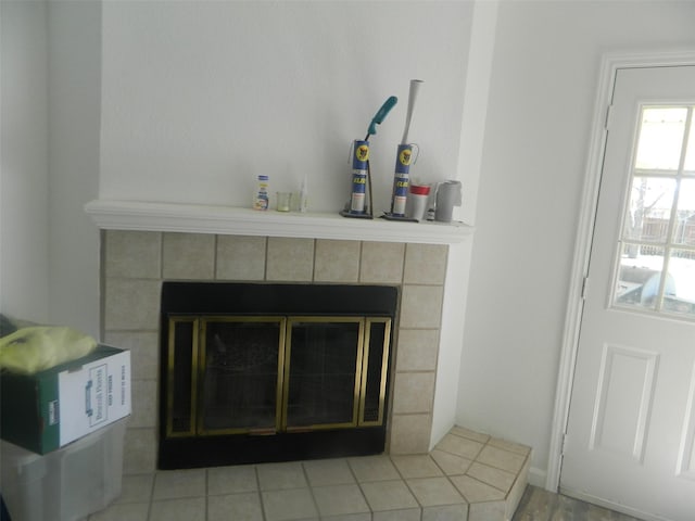 room details featuring a tiled fireplace